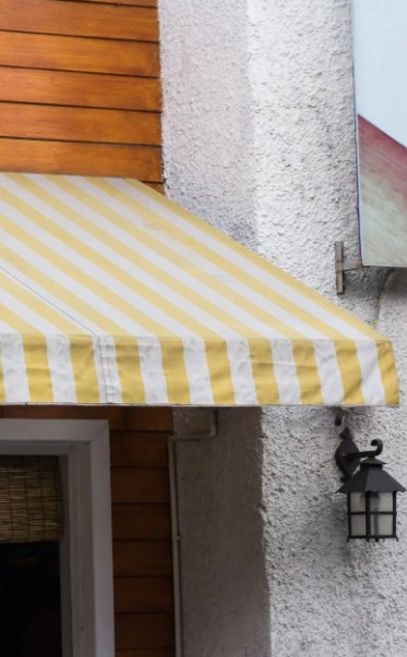 Yellow and white striped awnings